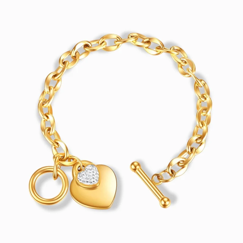 Glozya 18K Gold Plated Heart Charm Bracelet featuring a toggle closure and cubic zirconia heart charm on a stainless steel gold-plated chain.