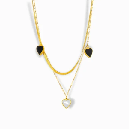 18K Gold Plated Layered Necklace with black and white heart pendants.