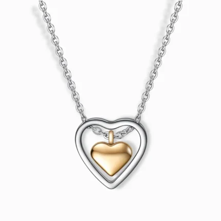 Stainless steel two-tone heart pendant necklace in silver and gold plating.